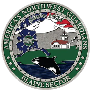 blaine washington coin with water, a whale, a lighthouse, mountains and the state outline filled in with USBP and thee words America's Northwest Guardians, Blaine Sector