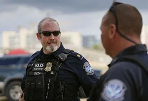 Supervisory CBPO Officer David Smith confers with a colleague during X-ray truck operations in New Orleans