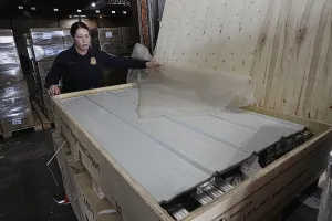 CBP Officer Melinda Tonglet inspects merchandise for any possible intellectual property rights violations