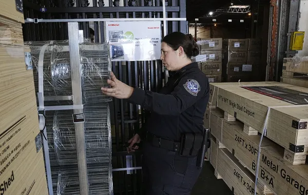 CBP Officer Melinda Tonglet inspects merchandise for any possible intellectual property rights violations