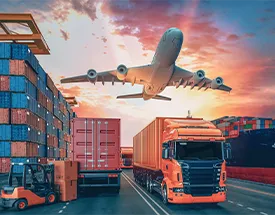 Cargo shipping containers, orange truck, and plane in air. Sunset in background.