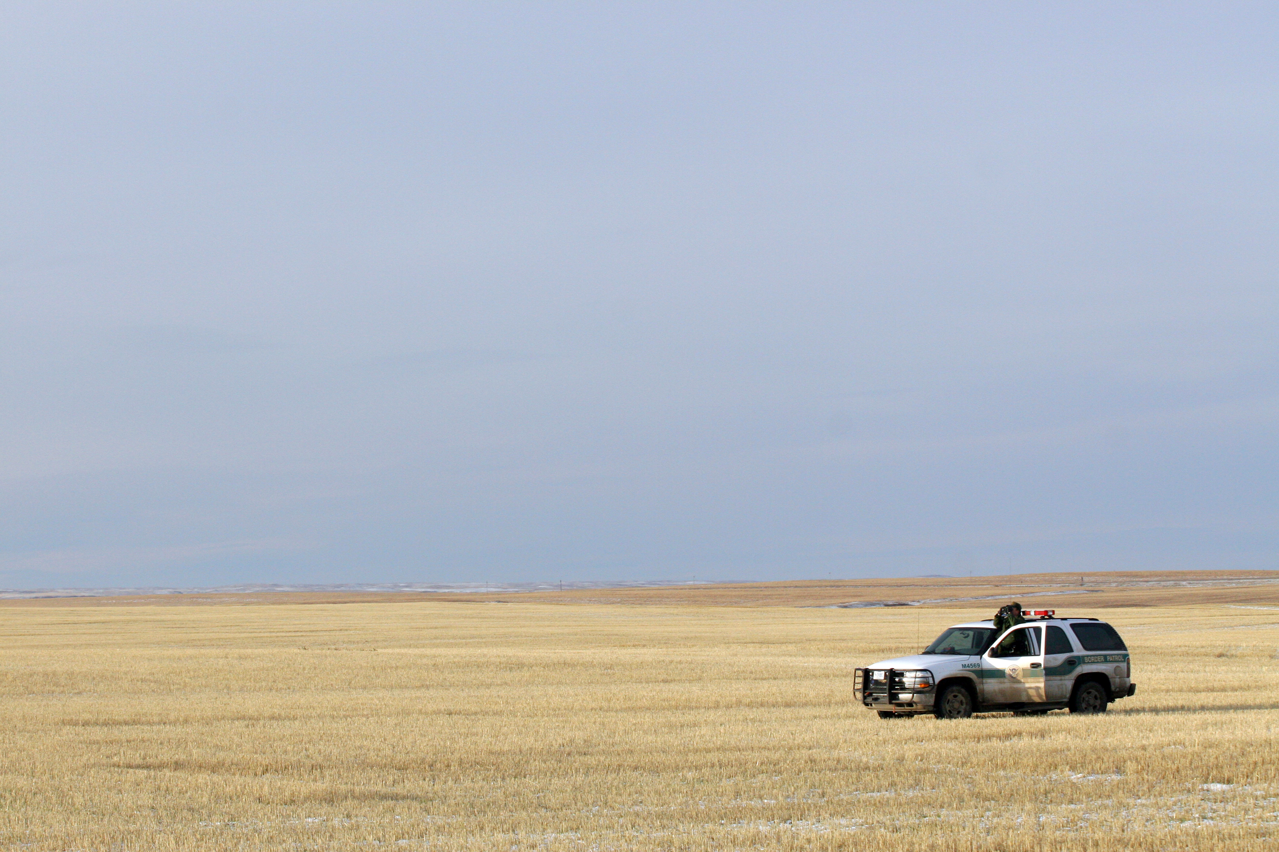 CBP Border Patrol agent monitors US/Canadian border near Sweet Grass Montana.